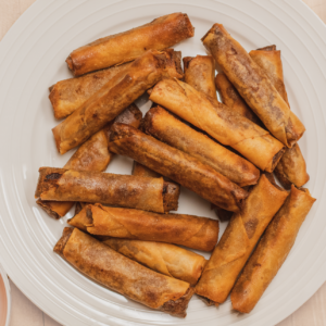 plate of vegan lumpia with sweet chili and vinegar