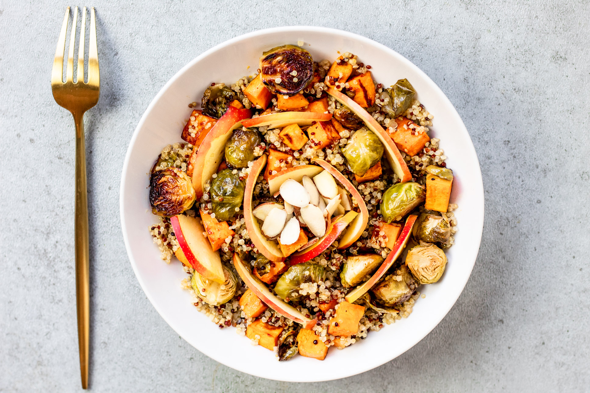 Maple Balsamic Harvest Bowl with brussel sprouts, sweet potatoes, quinoa, and apple