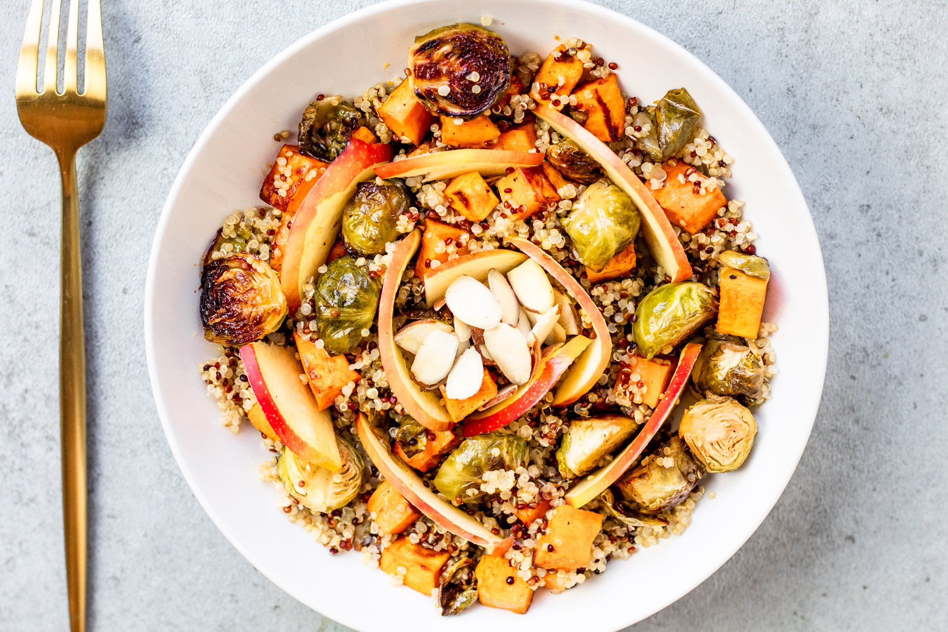 Maple Balsamic Harvest Bowl with brussel sprouts, sweet potatoes, quinoa, and apple