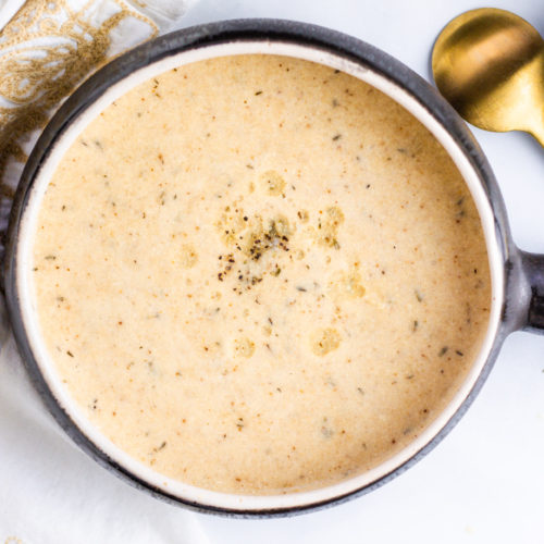 Vegan Roasted Cauliflower Soup with truffle oil. Food photography