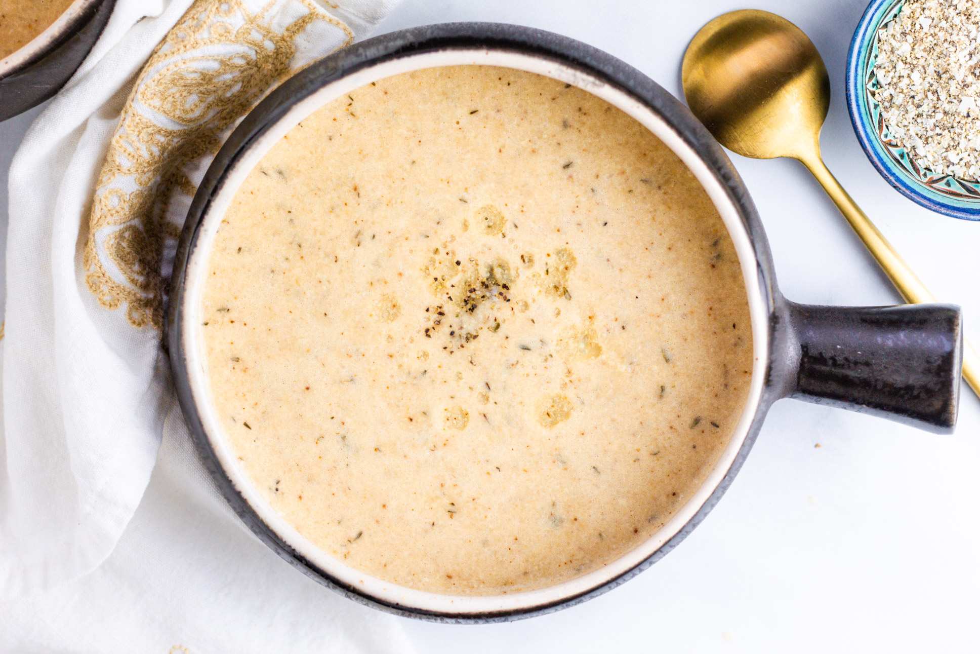 Vegan Roasted Cauliflower Soup with truffle oil. Food photography