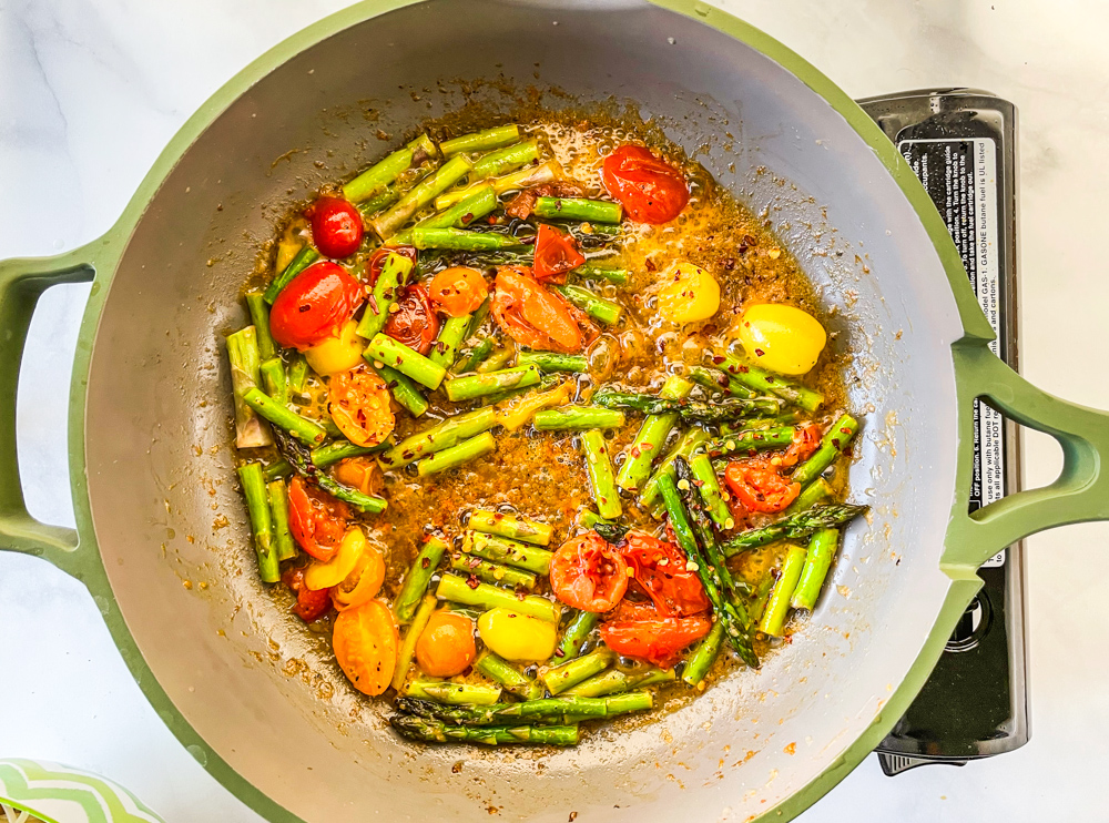 Springtime Pasta Vegan sauce with plantbased butter, garlic, asparagus, cherry tomatoes, and lemon