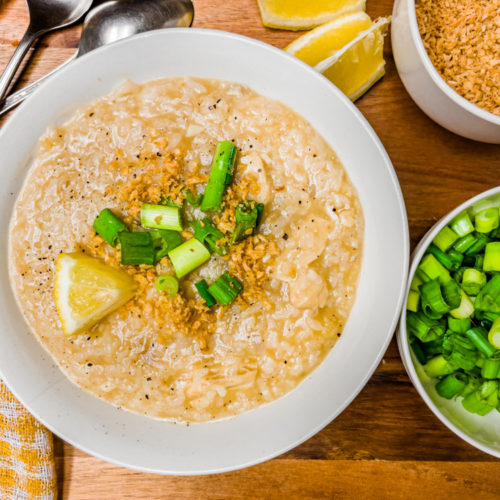 vegan arroz caldo filipino congee plantbased recipe with green onions, garlic, and lemon