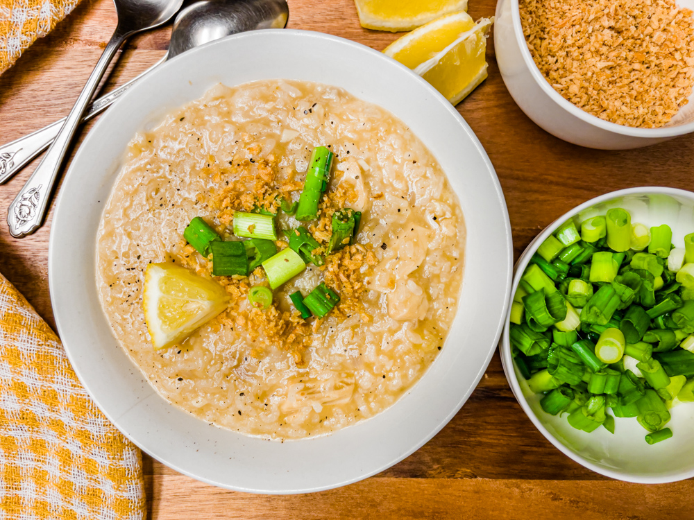 vegan arroz caldo filipino congee plantbased recipe with green onions, garlic, and lemon