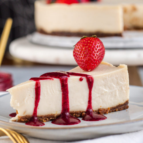 New York Vegan Cheesecake - slice with berry sauce plantbased strawberries